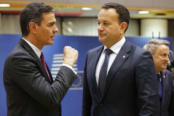 Spain's Prime Minister Pedro Sanchez, left, speaks with Ireland's Prime Minister Leo Varadkar during a round table meeting at an EU summit in Brussels, Thursday, Oct. 26, 2023. European Union leaders gather Thursday for a two day meeting to discuss, among other issues, Ukraine and the impact of the war between Israel and Hamas. (AP Photo/Omar Havana)