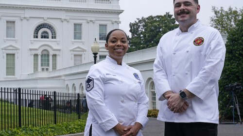 Air Force Master Sgt. and chef Opal Poullard, left, and Marine Corps Gunnery Sgt. and chef Dustin Lewis, right, pose for a photo at the White House in Washington, Friday, June 30, 2023. Poullard and Lewis were crowned "Chopped" champions during first lady Jill Biden's appearance on the season finale of the Food Network's Chopped "Military Salute." They will serve as guest chefs at the White House Navy Mess ahead of the 4th of July holiday. (AP Photo/Susan Walsh)