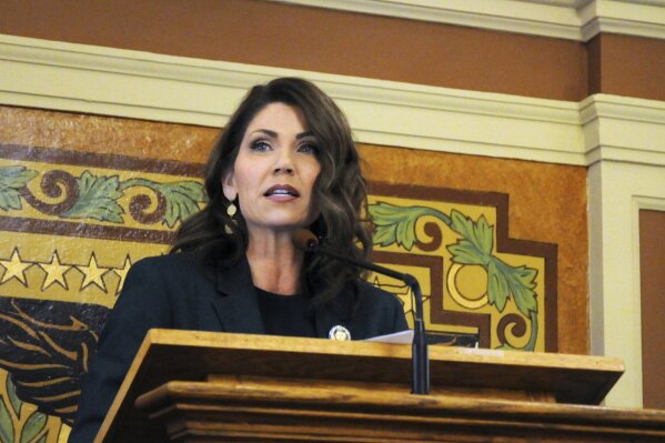 FILE - In this Jan. 23, 2019, file photo, Gov. Kristi Noem gives her first budget address to lawmakers at the state Capitol in Pierre, S.D. Hospitalizations from COVID-19 have hit their highest points recently throughout the Midwest, where the growth in new cases has been the worst in the nation. “In South Dakota, we didn’t take a one size fits all approach and the results have been incredible,” Gov. Kristi Noem told lawmakers in her state, which Johns Hopkins University says ranks second in the country for new cases per capita. (AP Photo/James Nord, File)