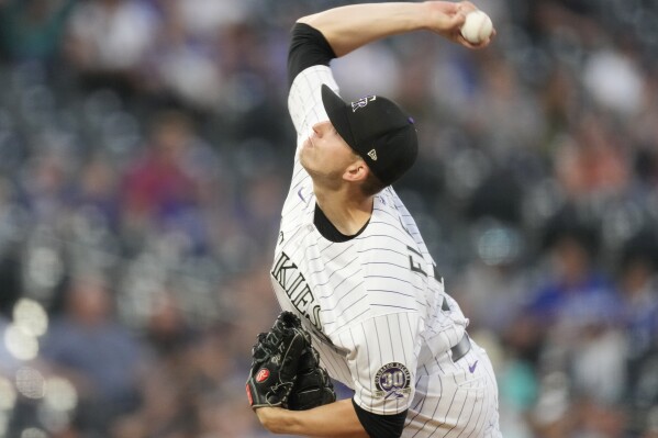 FILE - Colorado Rockies starting pitcher Chris Flexen works against the Los Angeles Dodgers in the first inning of a baseball game Sept. 28, 2023, in Denver. Flexen has agreed to a $1.75 million, one-year contract with the Chicago White Sox, giving manager Pedro Grifol another possibility for his rotation. A person familiar with the deal confirmed the agreement to The Associated Press on condition of anonymity because it was pending a physical. (AP Photo/David Zalubowski, File)