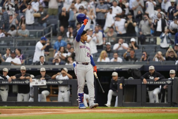 New York Mets' Juan Soto acknowledges the reaction of the crowd as he steps to the plate during the first inning of a baseball game against the New York Yankees Friday, May 16, 2025, in New York. (AP Photo/Seth Wenig)