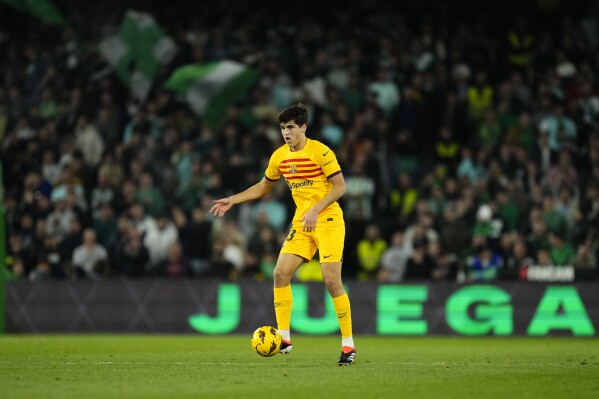 FILE - Barcelona's then-16 year old Pau Cubarsi controls the ball during a Spanish La Liga soccer match between Betis and Barcelona at the Benito Villamarin stadium in Seville, Spain, Sunday, Jan. 21, 2024. Spain has called up Barcelona’s 17-year-old Pau Cubarsí for the first time to play friendlies in preparation for this summer’s European championship in Germany. (AP Photo/Jose Breton, File)
