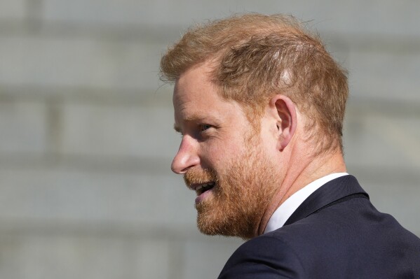 Prince Harry looks round as he arrives at St Paul's Cathedral for a 'Service of Thanksgiving' celebrating 10 years of the Invictus Games Foundation, in London, Wednesday, May 8, 2024. (AP Photo/Kirsty Wigglesworth)