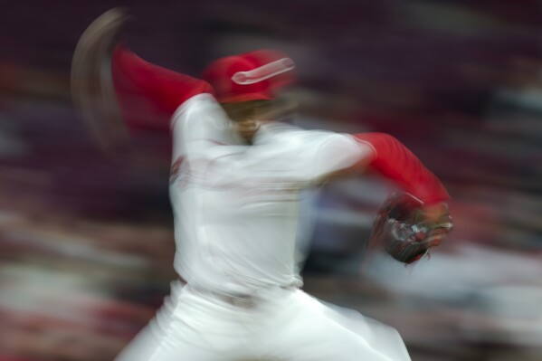 Cincinnati Reds' Alexis Diaz throws during a baseball game against the Milwaukee Brewers in Cincinnati, Monday, April 8, 2024. (AP Photo/Aaron Doster)