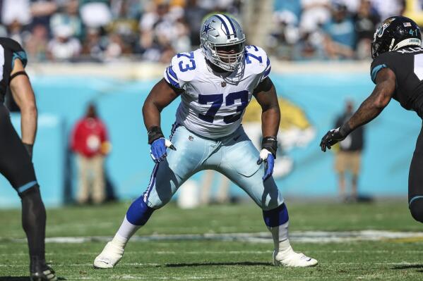 FILE -Dallas Cowboys offensive tackle Tyler Smith (73) in action during an NFL football game against the Jacksonville Jaguars, Sunday, Dec. 18, 2022, in Jacksonville, Fla. Tyler Smith likely will be back at left tackle for a divisional playoff at San Francisco on Sunday Jan. 22, 2023 returning to the spot he inherited when eight-time Pro Bowler Tyron Smith tore a hamstring in training camp. (AP Photo/Gary McCullough, File)