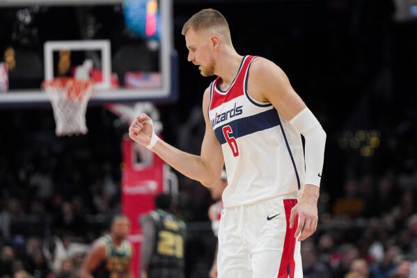 Washington Wizards center Kristaps Porzingis reacts after scoring against the Charlotte Hornets during the second half of an NBA basketball game Wednesday, Feb. 8, 2023, in Washington. (AP Photo/Jess Rapfogel)