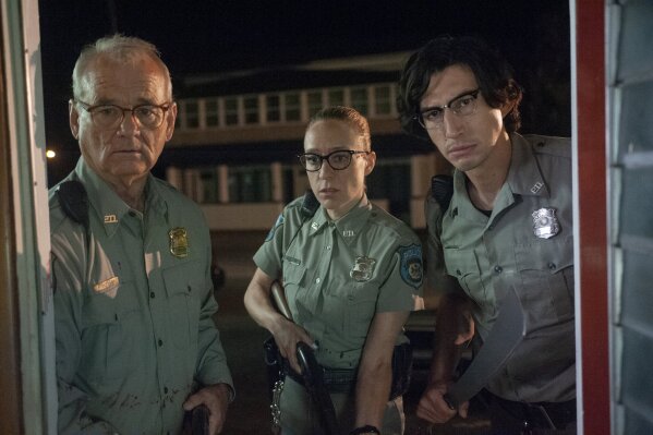 This image released by Focus Features shows Bill Murray, from left, Chloë Sevigny and Adam Driver in a scene from "The Dead Don't Die." (Abbot Genser/Focus Features via AP)
