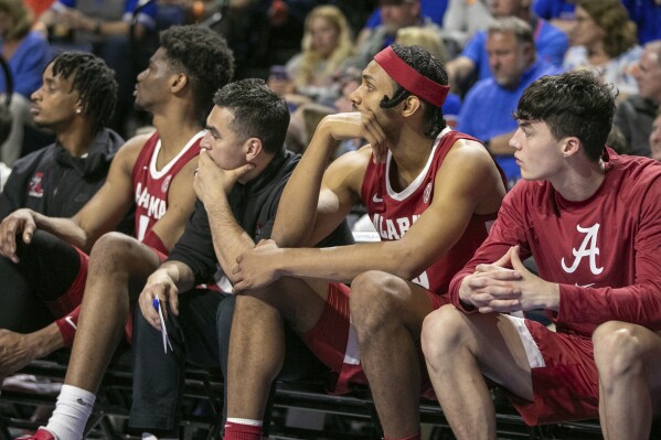 A sad Alabama bench contemplates the pending loss during the second half of an NCAA college basketball game against Florida Tuesday, March 5, 2024, in Gainesville, Fla. (AP Photo/Alan Youngblood)