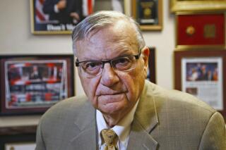 RETRANSMISSION TO CORRECT THE AMOUNT OF THE SETTLEMENT TO $5 MILLION - FILE - In this Aug. 26, 2019, file photo, former Maricopa County Sheriff Joe Arpaio poses for a portrait at his private office in Fountain Hills, Arizona. County officials approved a settlement on Wednesday, Oct. 20, 2021, with a restaurant owner in metro Phoenix who claimed in a lawsuit that Arpaio’s office had defamed him when he was still sheriff and violated his rights about seven years ago when investigating whether employees at his restaurants used fraudulent IDs to get jobs. Officials approved $3.1 million of the $5 million settlement that Uncle Sam’s owner Bret Frimmel will receive. The remaining $1.9 million in his settlement is being covered by an insurer. (AP Photo/Ross D. Franklin, File)