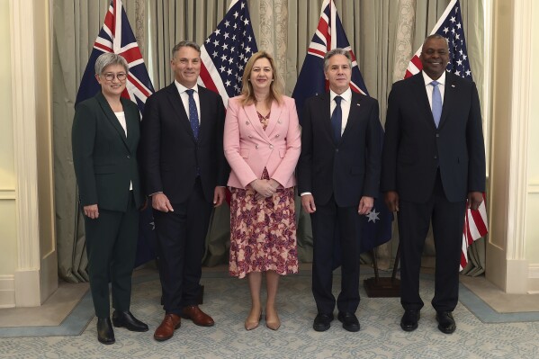 From left to right, Australia's Foreign Minister Penny Wong, Australia's Deputy Prime Minster Richard Marles, Queensland Premier Annastacia Palaszczuk, U.S. Secretary of State Antony Blinken and U.S. Secretary of Defense Lloyd Austin pose for a photo at Queensland Government House in Brisbane, Australia, Saturday, July 29, 2023. (Pat Hoelscher/Pool Photo via AP)