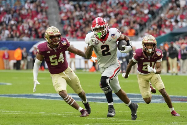 Georgia running back Kendall Milton (2) sprints past Florida State defense to run for a touchdown in the first half of the Orange Bowl NCAA college football game against Florida State, Saturday, Dec. 30, 2023, in Miami Gardens, Fla. (AP Photo/Rebecca Blackwell)