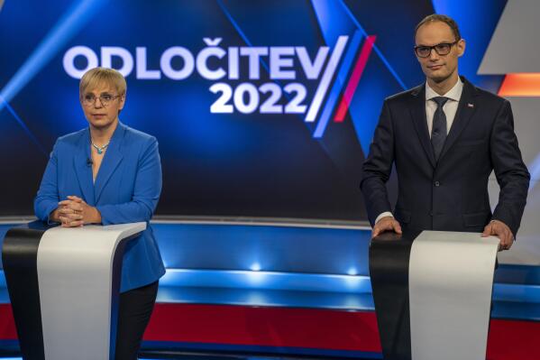 Liberal candidate Natasa Pirc Musar, left, and former Foreign Minister Anze Logar attend a TV debate in Ljubljana, Slovenia, Friday, Nov. 11, 2022. Run-off for the Slovenian presidential election is scheduled for Sunday, Nov. 13. (AP Photo/Darko Bandic)