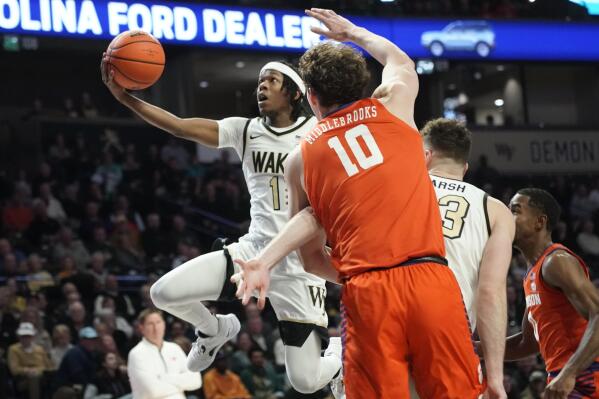 Wake Forest guard Tyree Appleby (1) drives past Clemson forward Ben Middlebrooks (10) during the first half of an NCAA college basketball game in Winston-Salem, N.C., Tuesday, Jan. 17, 2023. (AP Photo/Chuck Burton)