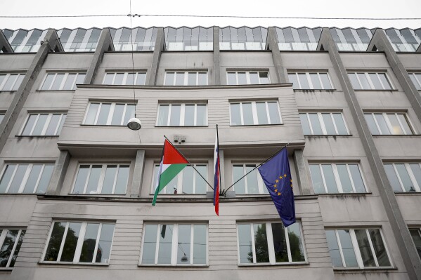 A Palestinian flag flies next to a Slovenian, center, and a European Union flag, right, at the government building in Ljubljana, Slovenia, Thursday, May 30, 2024. Slovenia’s government has endorsed a motion to recognize a Palestinian state and sent it to parliament for approval. Prime Minister Robert Golob's ruling liberal coalition has a comfortable majority in the 90-member assembly and the vote should be formality. The decision by the Slovenian government on Thursday comes just two days after Spain, Norway and Ireland recognized a Palestinian state. It was a move that was slammed by Israel. (AP Photo)