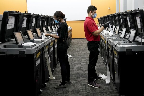 Employees at the Broward Supervisor of Elections Office conduct logic and accuracy testing of equipment used for counting ballots, Thursday, Sept. 24, 2020, in Lauderhill, Fla. Vote-by-mail ballots for the general election will begin going out to residents in Broward County Thursday. (AP Photo/Lynne Sladky)