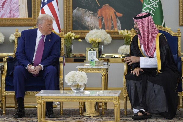 President Donald Trump speaks with Saudi Crown Prince Mohammed bin Salman during a coffee ceremony at the Royal Terminal of King Khalid International Airport in Riyadh, Saudi Arabia, Tuesday, May 13, 2025. (AP Photo/Alex Brandon)