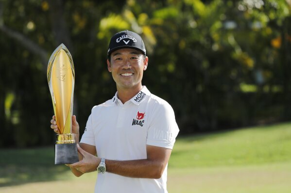 Kevin Na holds the Sony Open trophy after winning the final round of the Sony Open golf tournament, Sunday, Jan. 17, 2021, at Waialae Country Club in Honolulu. (Jamm Aquino/Honolulu Star-Advertiser via AP)