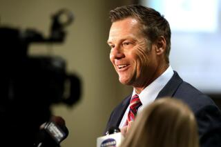 FILE - In this Aug. 4, 2020 file photo, Kris Kobach, a candidate for the Republican nomination for U.S. Senate, talks with reporters at his primary watch party in Leavenworth, Kan. Polarizing conservative Kris Kobach launched a campaign Thursday, April 29, 2021, for Kansas attorney general, attempting a political comeback in 2022 after losing nationally watched races for governor and U.S. Senate. (AP Photo/Orlin Wagner ,File)