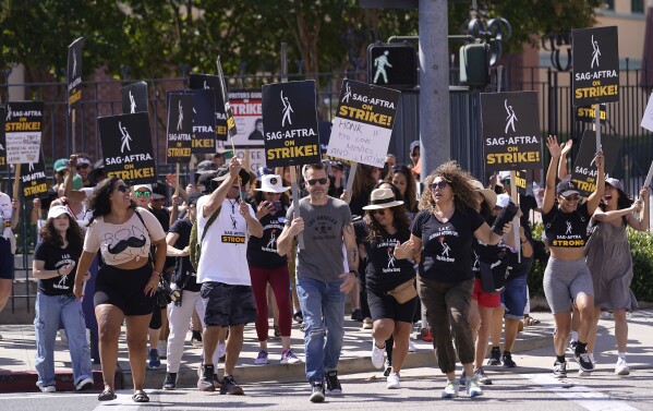 Actor Max Greenfield urges studio CEOs to 'be the heroes' and make a deal  in Hollywood strikes