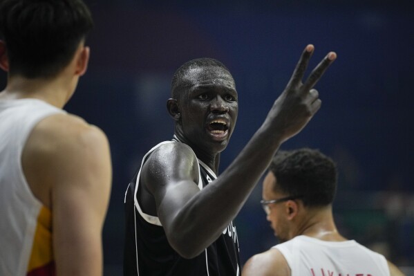 South Sudan center Khaman Madit Maluach (6) gestures during their Basketball World Cup group B match against China at the Araneta Coliseum in Manila, Philippines Monday, Aug. 28, 2023. (AP Photo/Aaron Favila)