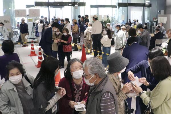 A floor is crowded with elderly people who want to make a reservation for the coronavirus vaccine in Kochi, western Japan on April 23, 2021. Japan's rollout of COVID-19 vaccines began belatedly in mid-February, months behind the United States and many other countries. Officials blamed a shortage of Pfizer Inc. vaccine from Europe as the main culprit in the delay. But three months later, with shipments stabilized and officials attempting to accelerate vaccinations, Japan remains one of the world's least protected. (Kyodo News via AP)