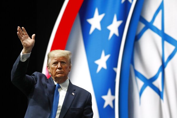 President Donald Trump waves as he speaks at the Israeli American Council National Summit in Hollywood, Fla., Saturday, Dec. 7, 2019. (AP Photo/Patrick Semansky)