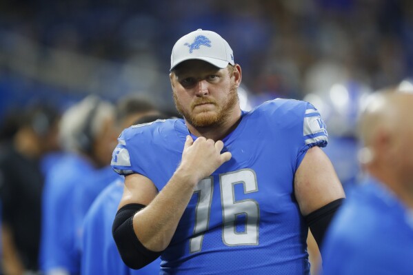 FILE - Detroit Lions offensive guard T.J. Lang looks on during the second half of a preseason NFL football game against the New York Giants in Detroit, Aug. 17, 2018. Former NFL offensive lineman T.J. Lang says no one discussed mental health 15 years ago at the start of his career. A lot has changed. (AP Photo/Paul Sancya, File)