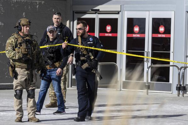 Law enforcement officers are pictured at the scene of a reported shooting at a Target store in Omaha, Neb., on Tuesday, Jan. 31, 2023. Omaha Police Chief Todd R. Schmaderer says city police confronted and shot a man with an assault rifle. (Chris Machian/Omaha World-Herald via AP)