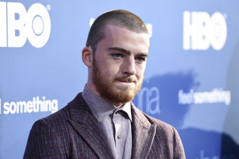 FILE - Angus Cloud, a cast member in the HBO drama series "Euphoria," poses at the premiere of the series at the ArcLight Hollywood, Tuesday, June 4, 2019, in Los Angeles. Cloud, the actor who starred as the drug dealer Fezco "Fez" O'Neill on the HBO series "Euphoria," has died. He was 25. Cloud's publicist, Cait Bailey, said McCloud died Monday at his family home in Oakland, California. No cause of death was given. (Photo by Chris Pizzello/Invision/AP, File)