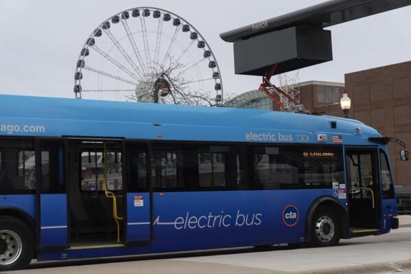 A Chicago Transit Authority electric bus charges at Navy Pier Tuesday, Feb. 14, 2023, in Chicago. No. 66 is the first of many routes that will be converted to battery power as the CTA moves to all-electric by 2040. (AP Photo/Erin Hooley)