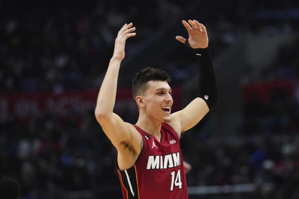 Miami Heat guard Tyler Herro (14) reacts after a basket is scored during the second half of an NBA basketball game against Los Angeles Clippers, Monday, Jan. 2, 2023, in Los Angeles. (AP Photo/Allison Dinner)