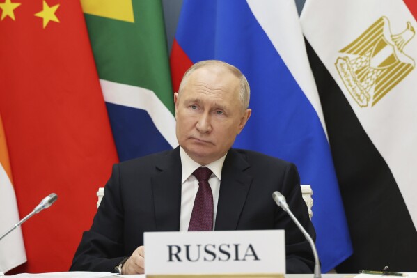 Russian President Vladimir Putin takes part in an extraordinary BRICS summit to discuss the Palestinian-Israeli conflict via videoconference at the Kremlin in Moscow, Russia, Tuesday, Nov. 21, 2023. (Mikhail Klimentyev, Sputnik, Kremlin Pool Photo via AP)