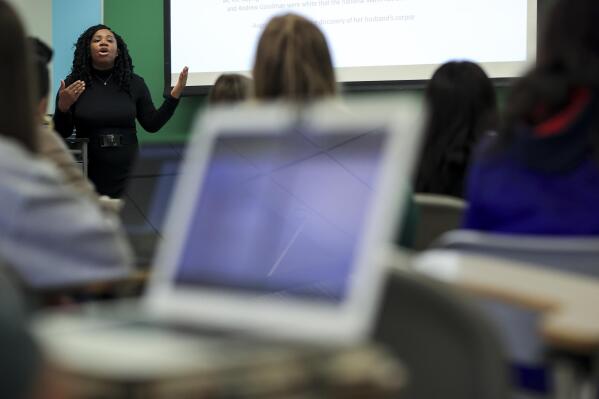 Dr. Shannen Dee Williams, associate professor of history at the University of Dayton, speaks to her students during a class, Thursday, April 21, 2022, in Dayton, Ohio. Williams spent 14 years researching America's Black nuns, and her history of them, "Subversive Habits," will be published May 17. Williams found that many Black nuns were modest about their achievements and reticent about sharing details of bad experiences, such as encountering racism and discrimination. (AP Photo/Aaron Doster)