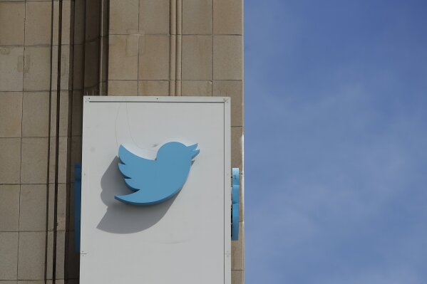 FILE - This July 9, 2019, file photo shows a sign outside of the Twitter office building in San Francisco. Twitter is bringing back special labels to help users identify accounts and tweets from U.S. political candidates. The company, which first used such labels for the midterms last year, said it is trying to provide users with original sources of information and prevent spoofed and fake accounts from fooling voters. (AP Photo/Jeff Chiu, File)