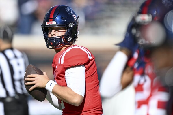 FILE - Mississippi quarterback Jaxson Dart (2) warms up before an NCAA college football game against Louisiana Monroe in Oxford, Miss., Saturday, Nov. 18, 2023. The much-anticipated matchup in Saturday’s Peach Bowl is No. 10 Penn State’s top-ranked defense against No. 11 Mississippi’s up-tempo offense. (AP Photo/Thomas Graning, File)