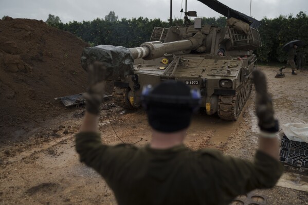 An Israeli mobile howitzer gets into position near the border with Lebanon in northern Israel, Thursday, Jan. 11, 2024. (AP Photo/Leo Correa)
