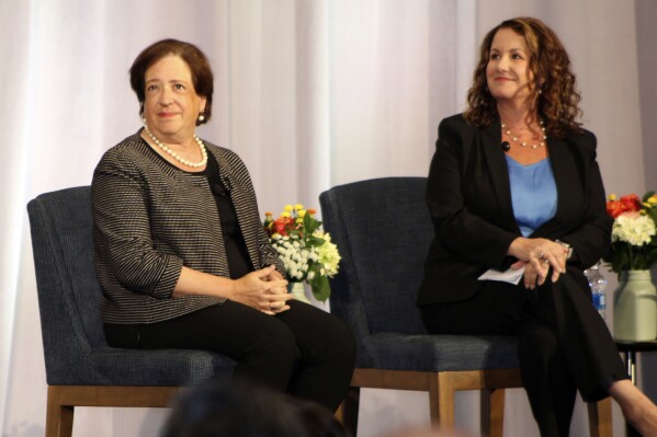 U.S. Supreme Court Justice Elena Kagan, left, sits onstage for a panel at the 9th Circuit Judicial Conference on Thursday, August 3, 2023, in Portland, Ore., with Misty Perry Isaacson, a bankruptcy lawyer and chair for the 9th Circuit Lawyer Representatives Coordinating Committee. While speaking at the conference, Kagan publicly declared her support for an ethics code for the Supreme Court but said there was no consensus among the justices on how to proceed. (AP Photo/Claire Rush)