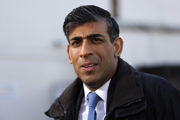 Britain's Prime Minister Rishi Sunak looks on during a media visit to Harlow Police Station in Essex, England, Friday Feb. 16, 2024. (Dan Kitwood/Pool Photo via AP)