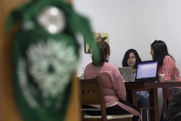 Members of the Marea Verde Chihuahua collective meet at their headquarters in Chihuahua, Mexico, Monday, March 13, 2023. The organization of volunteers has supported reproductive rights in northern Mexico since 2018, providing virtual guidance as well as shipments of abortion pills for women who want to terminate a pregnancy on their own, sparking requests from the U.S. after the Supreme Court eliminate the constitutional right to abortion in 2022. (AP Photo/Adriana Esquivel)