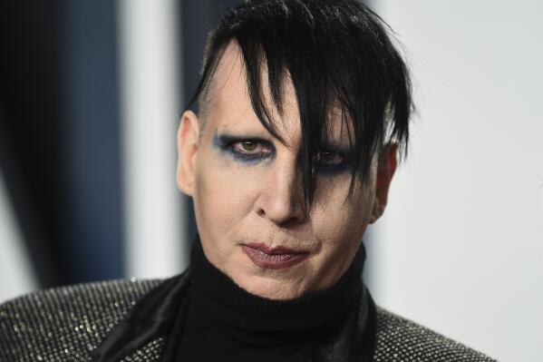 FILE - Marilyn Manson arrives at the Vanity Fair Oscar Party, Feb. 9, 2020, in Beverly Hills, Calif. On Tuesday, May 9, 2023, a California judge threw out key sections of Manson's lawsuit against his former fiancée, “Westworld” actor Evan Rachel Wood, claiming she fabricated public allegations that he sexually and physically abused her during their relationship and encouraged other women to do the same. (Photo by Evan Agostini/Invision/AP, File)