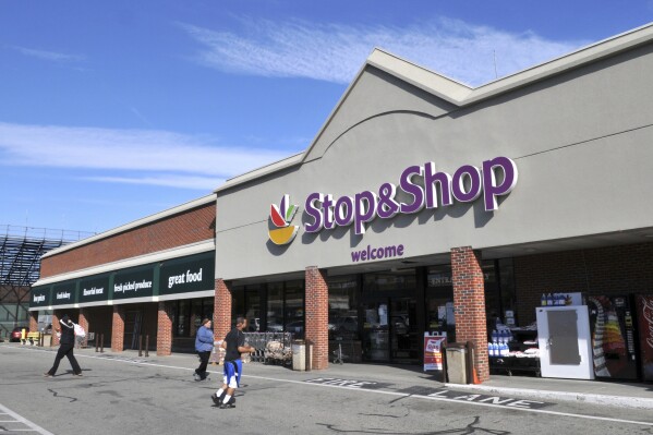 FILE - People walk outside a Stop & Shop in Newport, R.I., Feb. 13, 2012. R.I. (AP Photo/The Daily News, Dave Hansen)