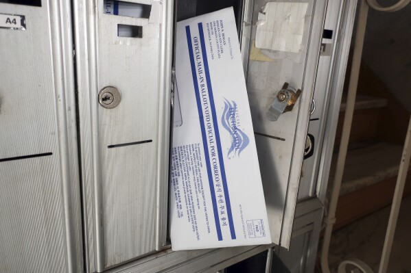 FILE - A mail-in election ballot is positioned in the mailbox where it arrived in Rutherford, N.J., on Friday, Oct. 2, 2020. A state judge on Friday, June 7, 2024, ruled that some 1,900 mail ballots in a New Jersey county whose envelopes were prematurely opened should be accepted and counted. (AP Photo/Ted Shaffrey, File)