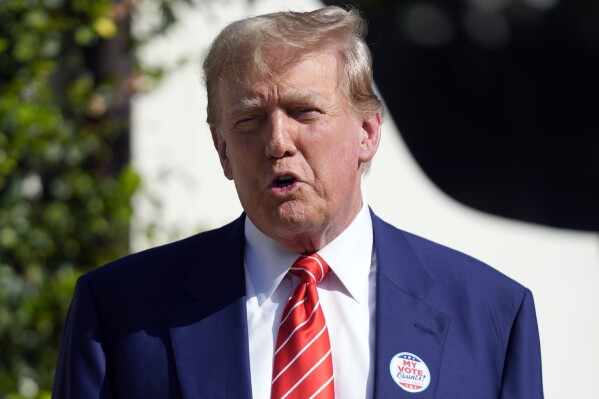 FILE - Republican presidential candidate former President Donald Trump speaks after voting in Florida's primary election in Palm Beach, Fla., Tuesday, March 19, 2024. Trump’s return to the stock market could be right around the corner. All eyes are on a vote Friday by shareholders of Digital World Acquisition Corp., a shell company that is looking to merge with the former president’s media business. (AP Photo/Wilfredo Lee, File)