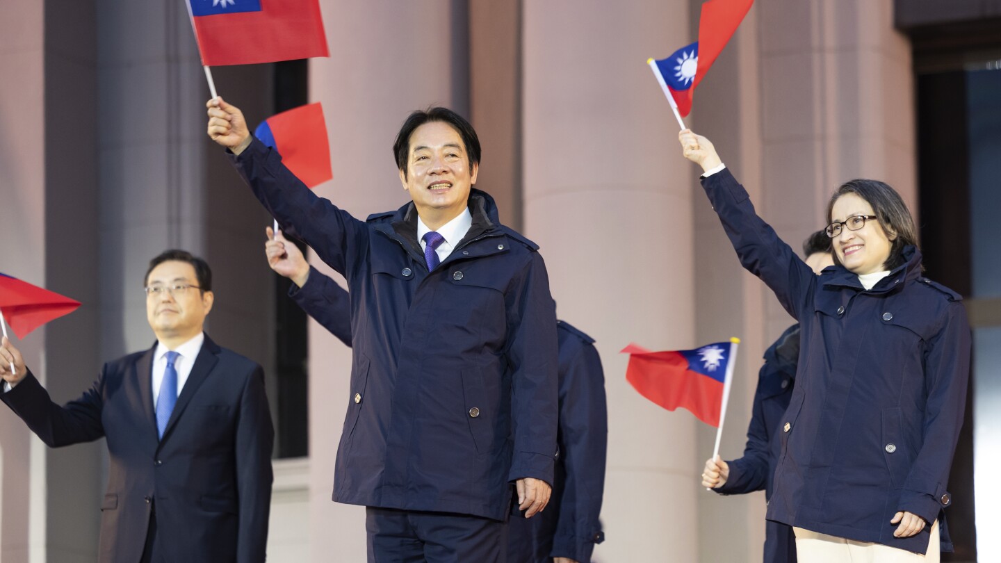 Taiwan president vows to boost the island’s defense budget as China threats rise