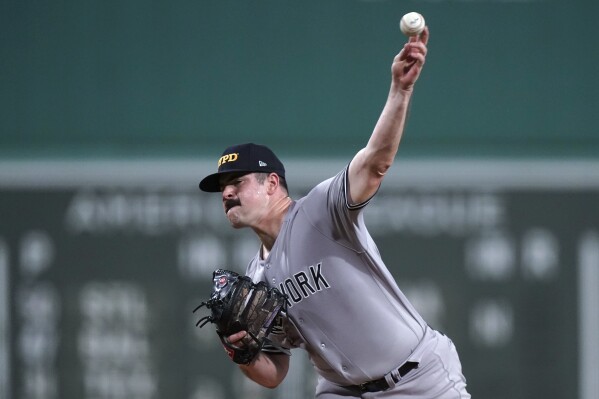 New York Yankees pitcher Clay Holmes throws against the Boston Red