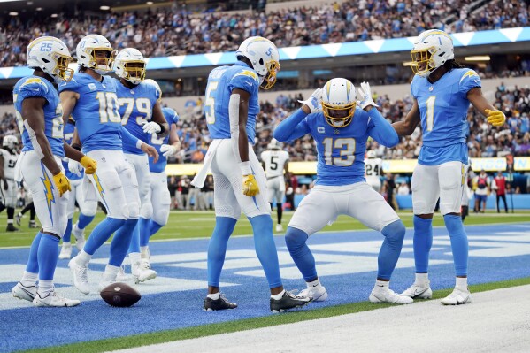 Los Angeles Chargers wide receiver Keenan Allen (13) celebrates his touchdown catch during the first half of an NFL football game against the Las Vegas Raiders Sunday, Oct. 1, 2023, in Inglewood, Calif. (AP Photo/Ashley Landis)