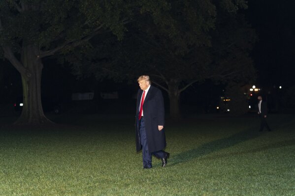 President Donald Trump walks on the South Lawn of the White House after stepping off Marine One, Wednesday, Oct. 21, 2020, in Washington. Trump is returning from North Carolina. (AP Photo/Alex Brandon)