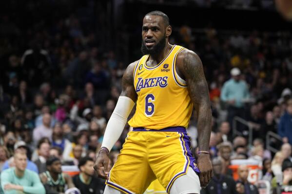 Los Angeles Lakers forward LeBron James celebrates after scoring during the first half of an NBA basketball game between the Charlotte Hornets and the Los Angeles Lakers on Monday, Jan. 2, 2023, in Charlotte, N.C. (AP Photo/Chris Carlson)