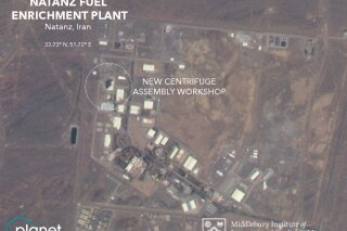 This Friday, July 3, 2020 satellite image from Planet Labs Inc. that has been annotated by experts at the James Martin Center for Nonproliferation Studies at Middlebury Institute of International Studies shows a damaged building after a fire and explosion at Iran's Natanz nuclear site. An online video and messages purportedly claiming responsibility for a fire that analysts say damaged a centrifuge assembly plant at Iran's underground Natanz nuclear site deepened the mystery Friday around the incident — even as Tehran insisted it knew the cause but would not make it public due to "security reasons." (Planet Labs Inc., James Martin Center for Nonproliferation Studies at Middlebury Institute of International Studies via AP)
