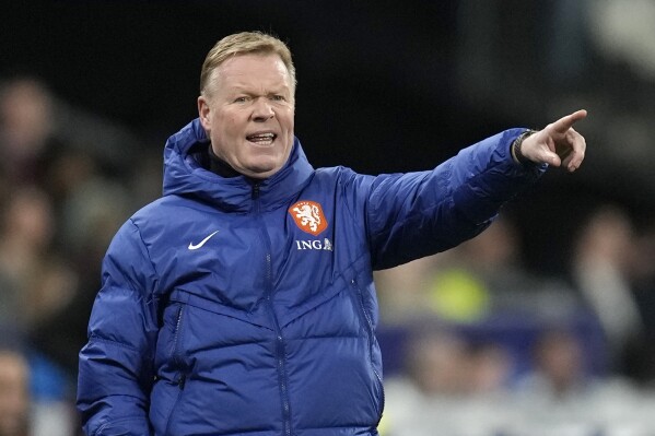 FILE - Netherlands' head coach Ronald Koeman gives instructions from the side line during the Euro 2024 group B qualifying soccer match between France and the Netherlands at the Stade de France in Saint Denis, outside Paris, France, Friday, March 24, 2023. Few aficionados in European soccer obsess about numbers the way the Dutch do. (AP Photo/Christophe Ena, File)